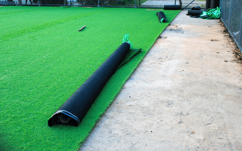 laying-down-artificial-grass